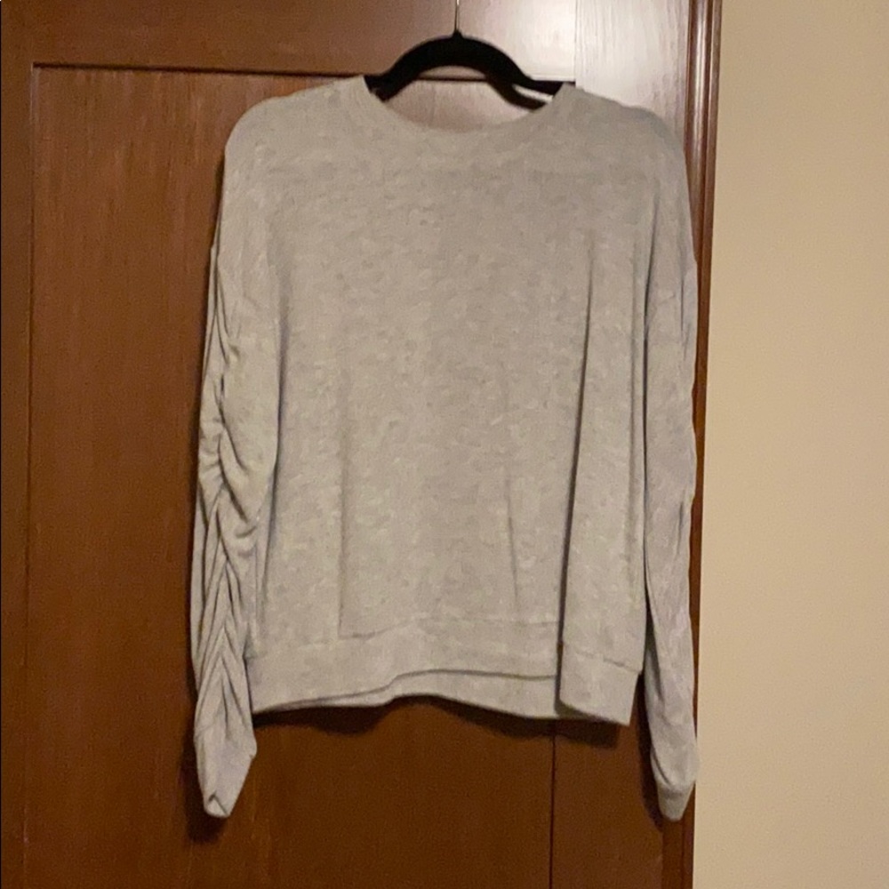 Grey sweater with cute touching detail on sleeves